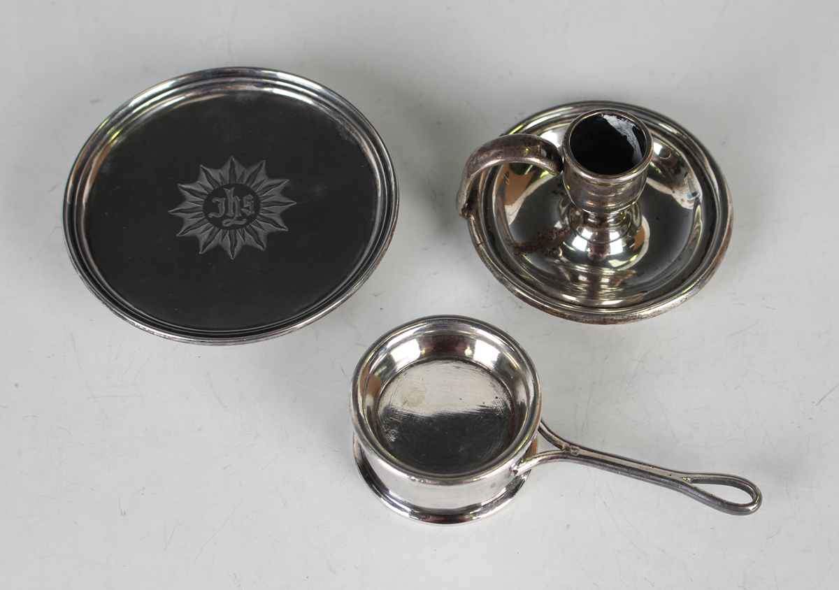 A Victorian silver paten with engraved 'IHS' to centre within a reeded rim, on a circular foot,
