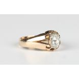 A gold and rose cut diamond single stone ring, mounted with a foil backed oval rose cut diamond,