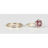 A 9ct gold, ruby and diamond nine stone cluster ring, claw set with five circular cut diamonds and