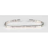 An 18ct white gold and diamond bracelet in a slightly curved and textured bar link design,