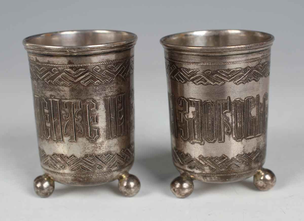 A pair of Russian silver beakers, 84 zolotnik, each of cylindrical form, decorated with Cyrillic - Image 8 of 8