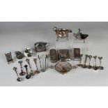 A George II silver cream boat of squat oval form with flying scroll handle, relief decorated with