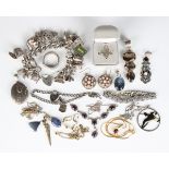 A group of mostly silver jewellery, comprising a curblink charm bracelet, another charm bracelet,