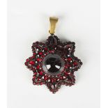 A Bohemian garnet pendant, second half of the 19th century, designed as an eight pointed