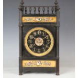 A late Victorian Aesthetic Movement slate clock with eight day cylinder movement chiming on a