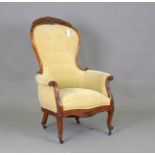 A mid-19th century walnut showframe gentleman's armchair, upholstered in yellow fabric, height