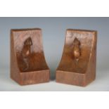 A pair of Robert 'Mouseman' Thompson oak bookends, each carved with typical mouse signatures, height