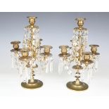 A pair of 20th century Victorian style gilt metal five-branch candelabra, foliate cast and hung with