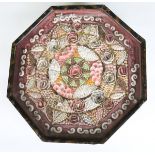 A 19th century sailor's shell valentine, decorated with concentric bands of coloured shells and
