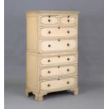 An early 20th century cream painted tallboy, fitted with an arrangement of drawers, height 144cm,