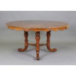 A mid-Victorian burr walnut circular centre table, the quarter-veneered top above three turned