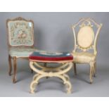 An early 20th century painted stool with tapestry seat and 'X' framed base, height 46cm, width 53cm,