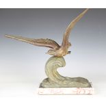 René Papa - an Art Deco green patinated cast spelter model of a gull on the crest of a wave, bearing