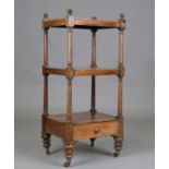 An early Victorian rosewood three-tier whatnot, fitted with a single drawer and raised on castors,