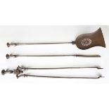 A set of three George III steel fire tools with octagonal baluster shaped handles, length 75cm.