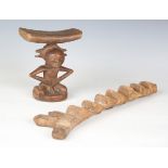 An African hardwood headrest of figural form, height 19cm, width 15cm, together with an African