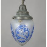 An Edwardian Arts and Crafts blue flashed and frosted glass ceiling light, the brass cap