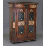 A 19th century Swiss painted softwood hall cupboard, the frieze initialled 'R A H' above birds,