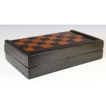 A George III ebonized folding games board, inlaid for chess and back gammon, width 53cm.Buyer’s