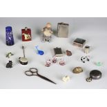 A selection of miniature collectors' items, including miniature folding knives, a cold painted