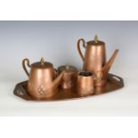 An early 20th century Secessionist copper tea set by WMF, comprising tray, teapot, hot water pot,