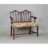 A late 19th century mahogany double seat settee, constructed from two George III dining chairs,