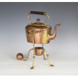 A late Victorian Arts and Crafts copper and brass kettle on heater stand by Benham & Froud, in the