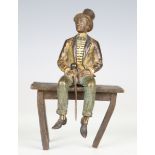 An early 20th century Austrian cold painted bronze figure depicting a gentleman with top hat and