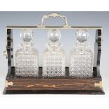 A late Victorian coromandel and nickel plate mounted three-bottle Betjeman's patent tantalus,