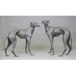A pair of 20th century verdigris patinated bronze floor-standing models of greyhounds, height