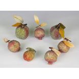 Three carved and painted hardstone models of fruit, width of apple 9cm, together with a group of