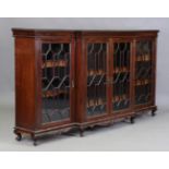 An early 20th century mahogany breakfront library bookcase by Hunter & Smallpace of York, the four