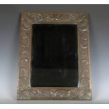 An early 20th century Arts and Crafts Glasgow School copper mounted rectangular mirror, probably