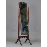 An early/mid-20th century mahogany framed cheval mirror, height 160cm, width 47cm.Buyer’s Premium