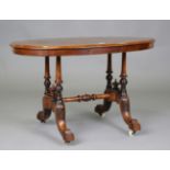 A late Victorian walnut and boxwood inlaid oval stretcher table, raised on carved legs, height 53cm,