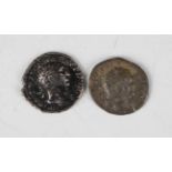 A collection of various Roman Empire coins, including a group of antoniniani, two denarii, various