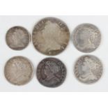A small collection of Queen Anne silver coinage, including a shilling 1711, a sixpence 1711 and a