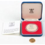 A France gold twenty francs 1914 and a Silver Jubilee proof crown 1977, with original Royal Mint