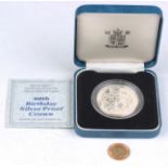 A George V half-sovereign 1911 and a silver proof commemorative crown 1980, with Royal Mint case.