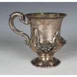 A William IV silver christening tankard of urn form, decorated in relief with a band of flowers