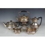 A silver harlequin five-piece tea set, each of cushion form with scallop shell and gadrooned rim