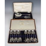 A George V silver dessert serving fork and spoon with engraved decoration, Sheffield 1913 by Allen &