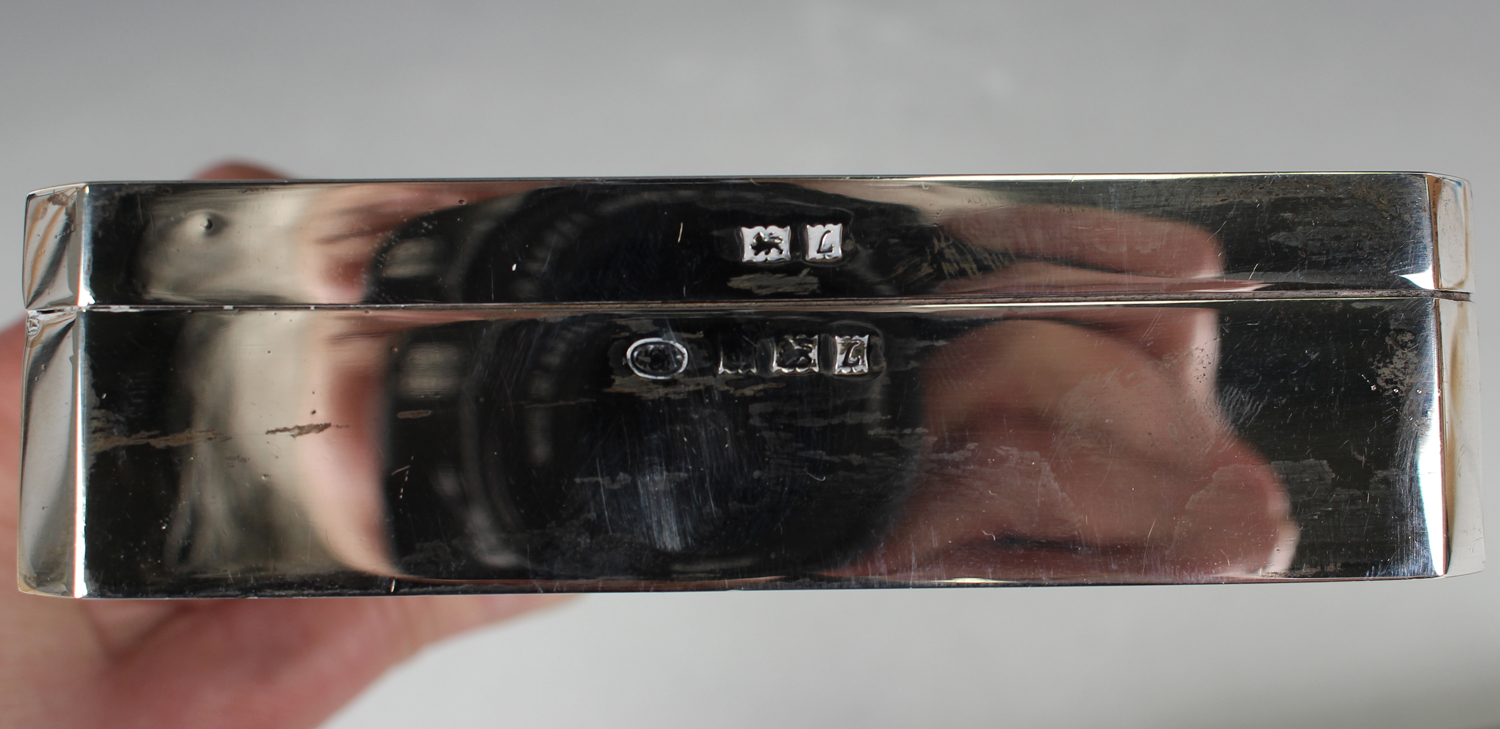 Two Elizabeth II silver rectangular cigarette boxes, each with an engine turned hinged lid, - Image 3 of 4