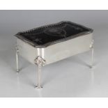 An Edwardian silver and tortoiseshell rectangular trinket box, the hinged lid piqué inlaid with