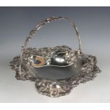 An early Victorian silver circular basket with pierced swing handle, the sides decorated in relief