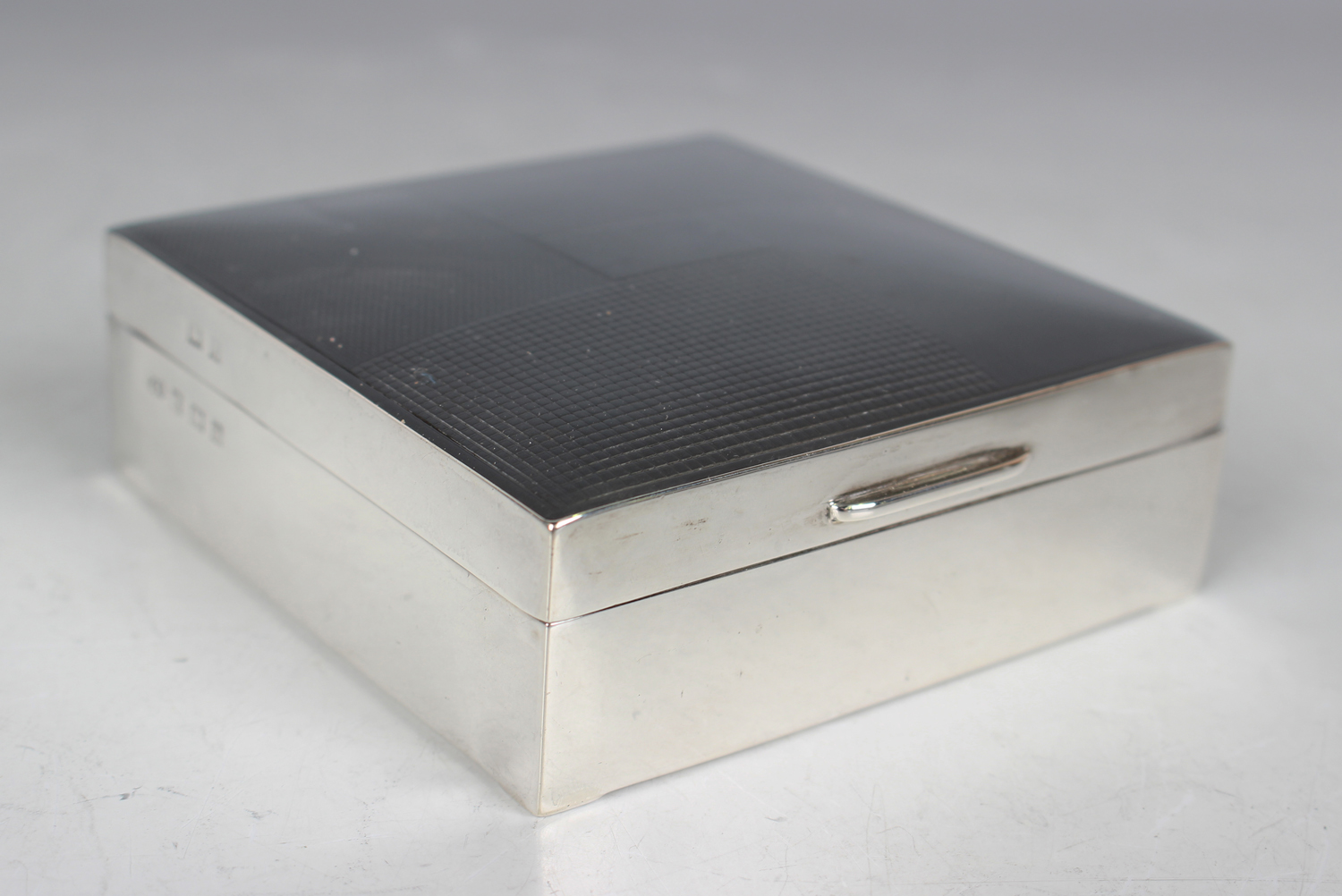 An Elizabeth II silver square cigarette box with geometric engine turned hinged lid, Birmingham 1954 - Image 7 of 7