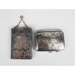 An early Victorian silver mounted aide-mémoire, the front and back engraved with foliate scrolls,