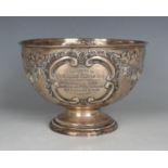 An Edwardian silver circular rose bowl, embossed with floral and ribbon garlands and opposing 'C'