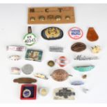 A collection of transport related insignia, including railway and bus company badges and buttons,