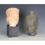 A modern cast composite head of Buddha, height 30cm, together with an ebonized pedestal and